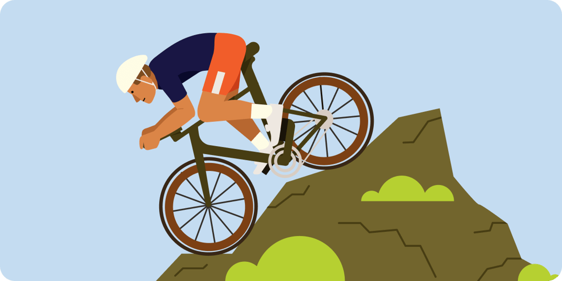 mountain biker riding downhill on light blue background